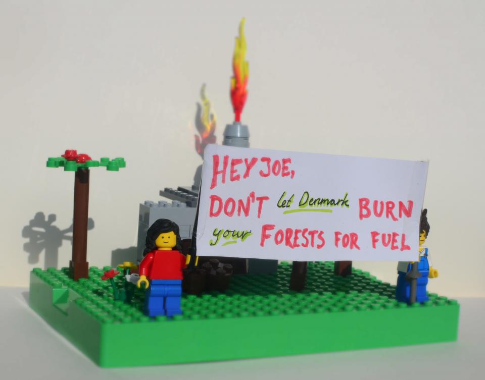 LEGO activists in front of a powerplant burning biomass